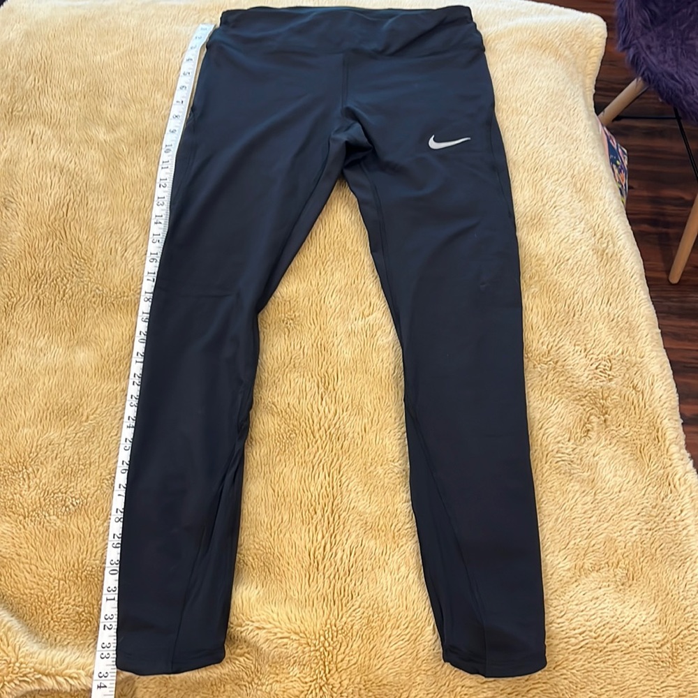 Nike leggings Dri fit size med pocket on side and zipper pocket on back
